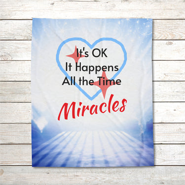 Inspirational plush blanket with “Miracles Happen” design and message